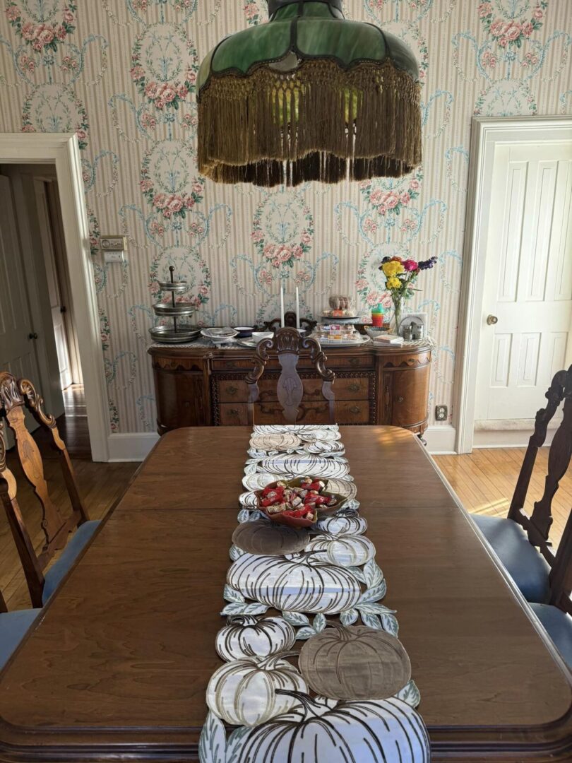 A dining room table with fruit on the plate.